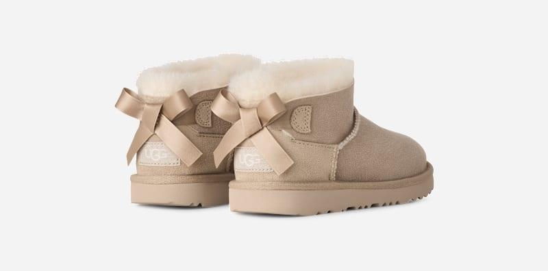 UGG® Ultra Mini Bailey Bow Boot 'Sand'